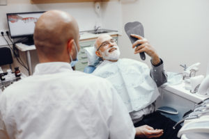 Old man sitting in the dentist's office